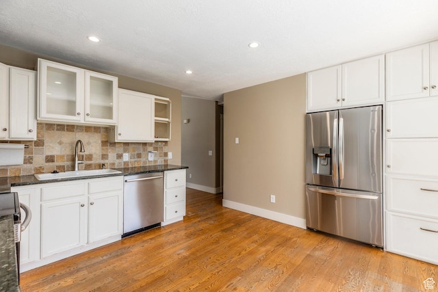 1104 E 220 N, Heber City, UT 84032 - kitchen with stainless steel appliances, recessed lighting, white cabinetry, decorative backsplash, and light wood-style floors