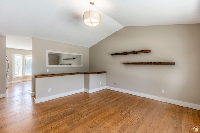 1104 E 220 N, Heber City, UT 84032 - unfurnished living room with wood finished floors and vaulted ceiling