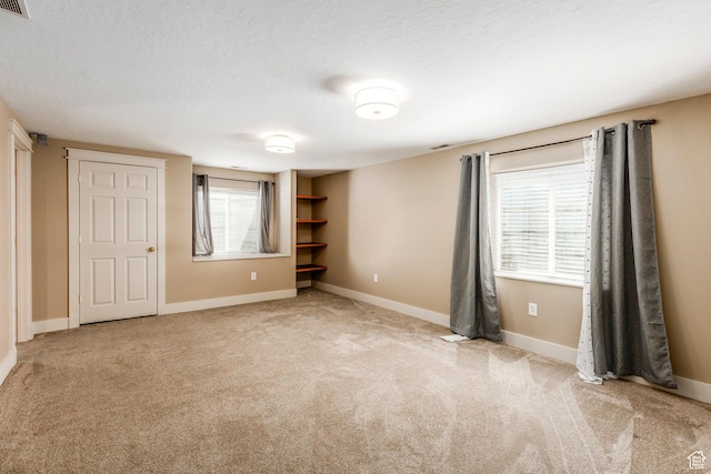 1104 E 220 N, Heber City, UT 84032 - unfurnished bedroom with light colored carpet and a textured ceiling
