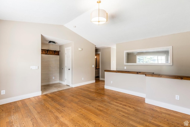 1104 E 220 N, Heber City, UT 84032 - unfurnished living room featuring light wood-style flooring and vaulted ceiling