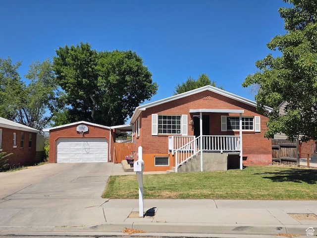 1525 N 1250 W, Provo, UT 84604 - view of front of home with driveway, brick siding, and an outbuilding