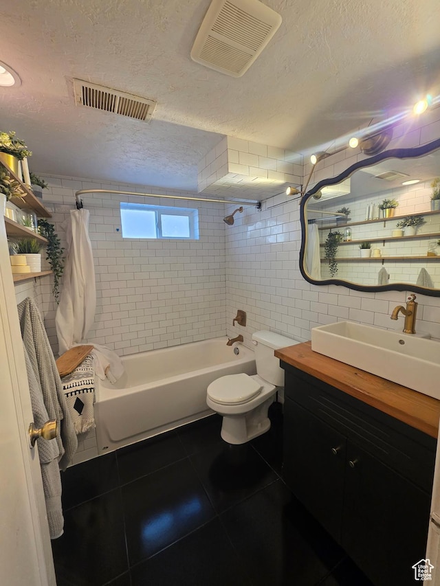 1525 N 1250 W, Provo, UT 84604 - full bath with a textured ceiling, tile patterned floors, shower / tub combo with curtain, vanity, and tile walls