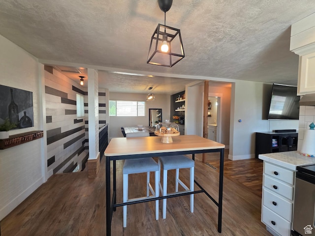 1525 N 1250 W, Provo, UT 84604 - kitchen with dark wood-type flooring, light countertops, white cabinetry, and hanging light fixtures