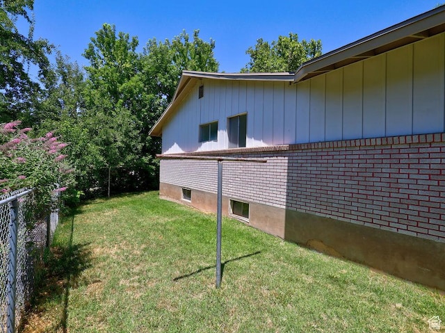 3165 S Jackson Ave, Ogden, UT 84403 - view of home's exterior with board and batten siding and brick siding