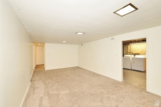 3165 S Jackson Ave, Ogden, UT 84403 - unfurnished room featuring washing machine and clothes dryer and light colored carpet