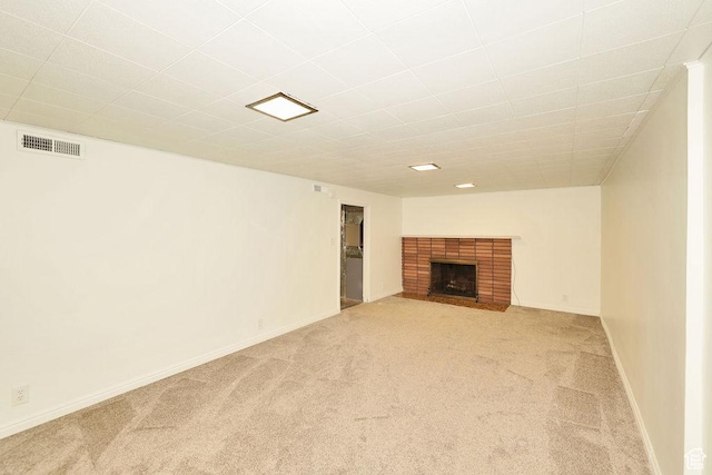 3165 S Jackson Ave, Ogden, UT 84403 - unfurnished living room featuring light colored carpet and a fireplace
