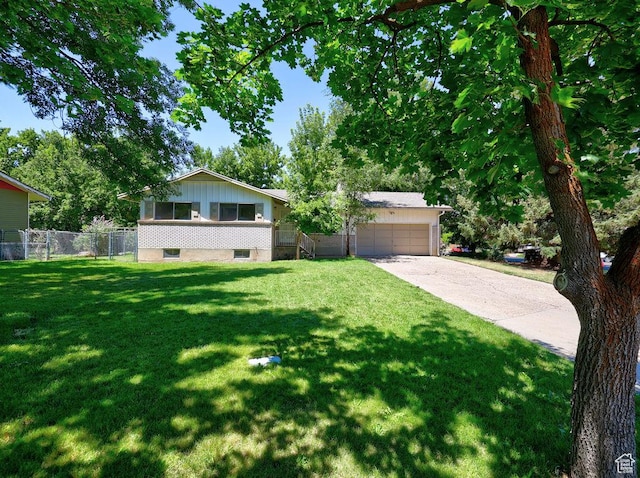 3165 S Jackson Ave, Ogden, UT 84403 - view of front facade featuring driveway and a garage