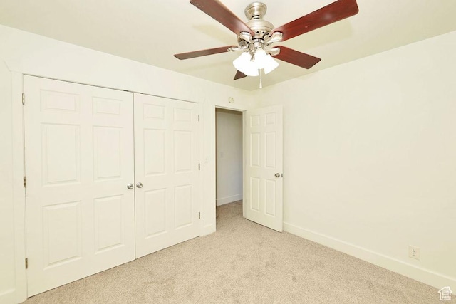 3165 S Jackson Ave, Ogden, UT 84403 - unfurnished bedroom featuring light colored carpet, a closet, and a ceiling fan