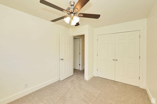 3165 S Jackson Ave, Ogden, UT 84403 - unfurnished bedroom featuring light colored carpet, a closet, and ceiling fan