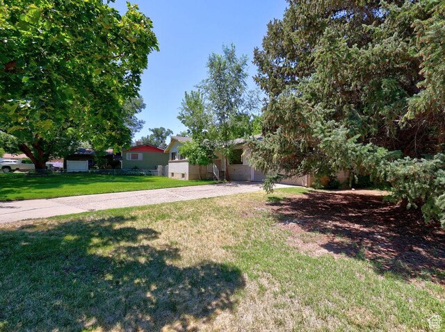 3165 S Jackson Ave, Ogden, UT 84403 - view of front of home with a front yard and driveway