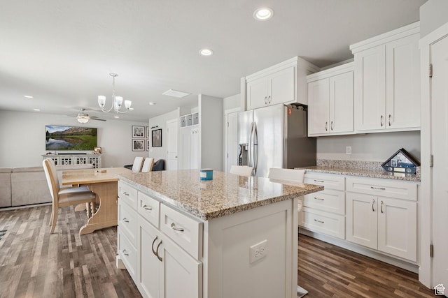 9634 N Red Bridge Rd, Eagle Mountain, UT 84005 - kitchen featuring stainless steel refrigerator with ice dispenser, a chandelier, dark wood-type flooring, a kitchen island, and white cabinetry