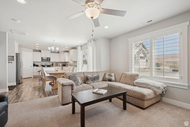 9634 N Red Bridge Rd, Eagle Mountain, UT 84005 - living room with a chandelier, recessed lighting, a ceiling fan, and light colored carpet