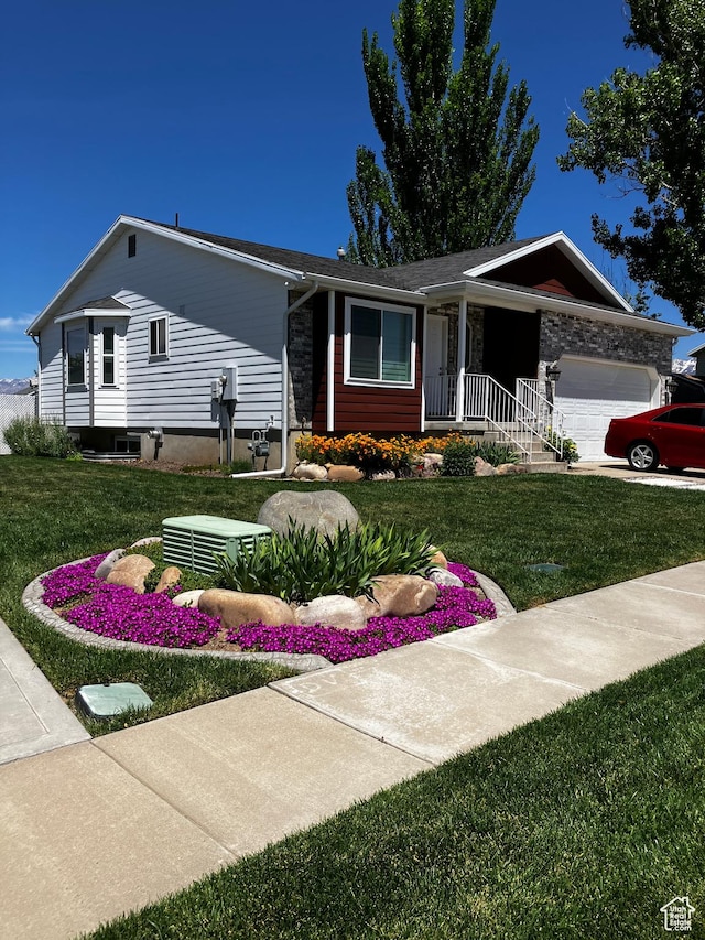 2256 W 1680 N, Clinton, UT 84015 - ranch-style home featuring an attached garage and a front lawn