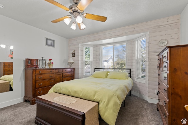 2256 W 1680 N, Clinton, UT 84015 - carpeted bedroom featuring wood walls and a ceiling fan