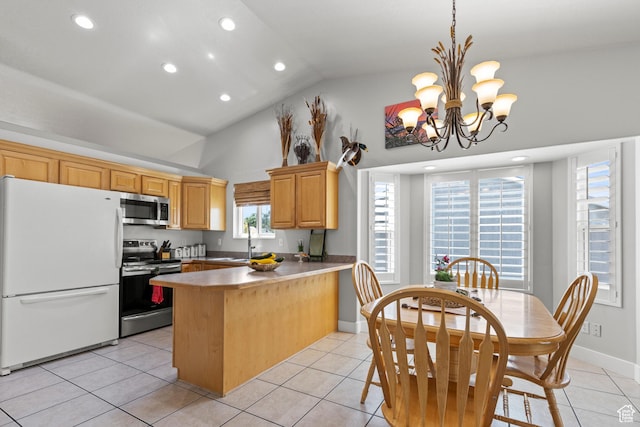 2256 W 1680 N, Clinton, UT 84015 - kitchen with appliances with stainless steel finishes, a peninsula, a chandelier, light tile patterned floors, and high vaulted ceiling
