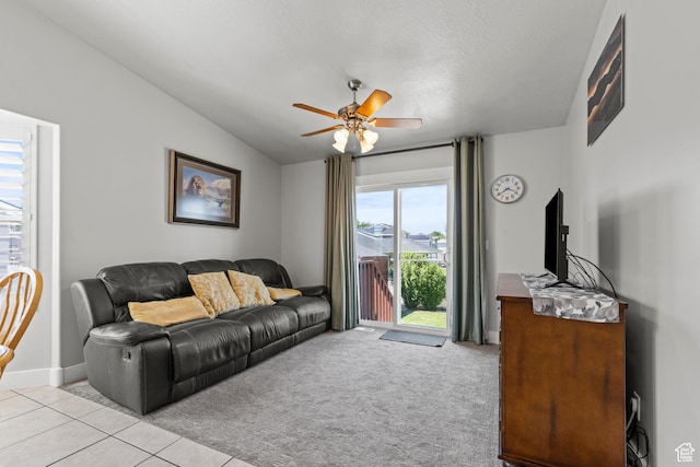 2256 W 1680 N, Clinton, UT 84015 - living room with lofted ceiling, ceiling fan, light tile patterned floors, and light colored carpet