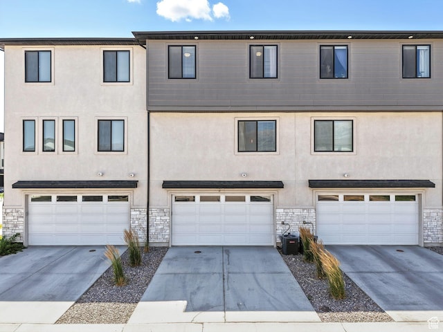 475 S 900 W, American Fork, UT 84003 - view of front of home featuring an attached garage, stucco siding, and stone siding