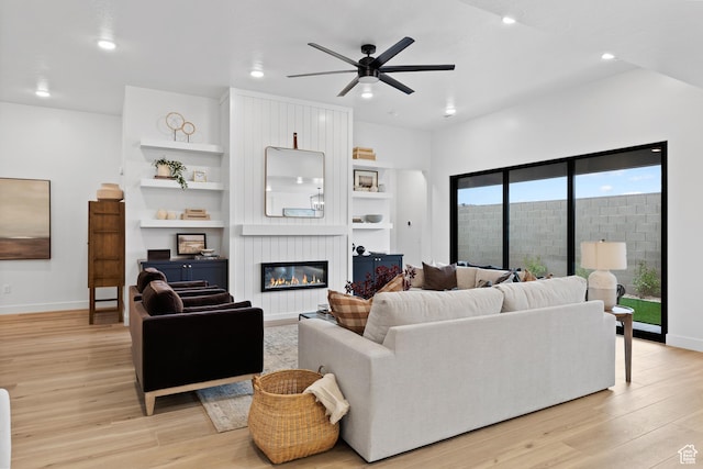 3353 W Bonita Unit 23, Hurricane, UT 84737 - living room featuring a ceiling fan, light wood-style flooring, recessed lighting, a fireplace, and built in shelves