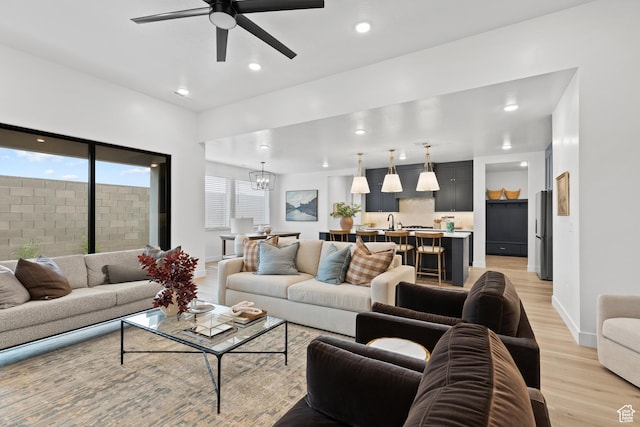 3353 W Bonita Unit 23, Hurricane, UT 84737 - living room with light wood-style flooring, ceiling fan, recessed lighting, and a chandelier