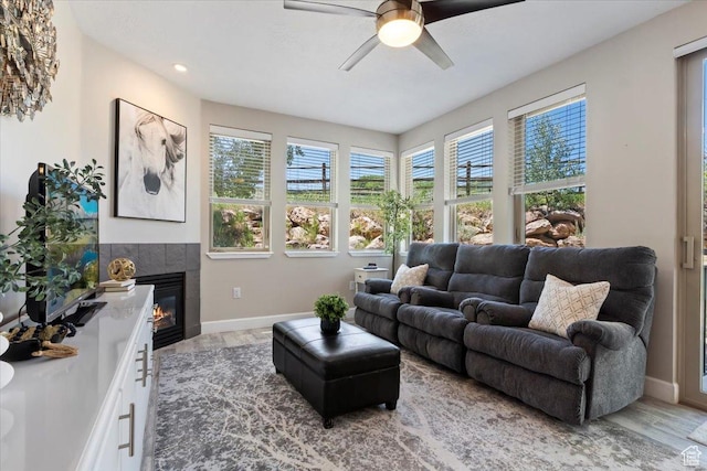 6641 N 2200 W Unit A107, Park City, UT 84098 - living area featuring a ceiling fan, wood finished floors, plenty of natural light, a tile fireplace, and recessed lighting