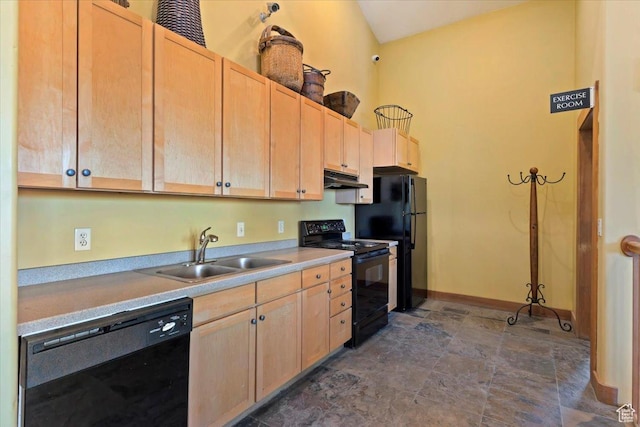 6641 N 2200 W Unit A107, Park City, UT 84098 - kitchen with black appliances, under cabinet range hood, light brown cabinetry, and light countertops