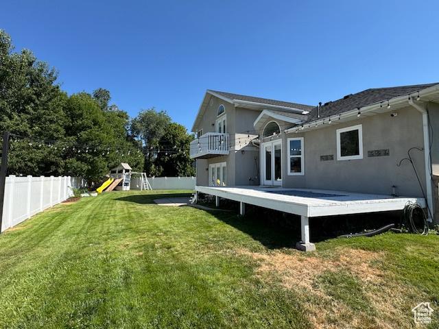 421 S 755 E, Layton, UT 84041 - back of property with a fenced backyard, french doors, stucco siding, and a wooden deck