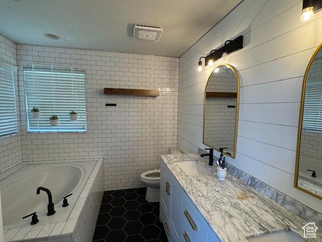 421 S 755 E, Layton, UT 84041 - bathroom featuring tile patterned flooring, double vanity, a garden tub, and tile walls