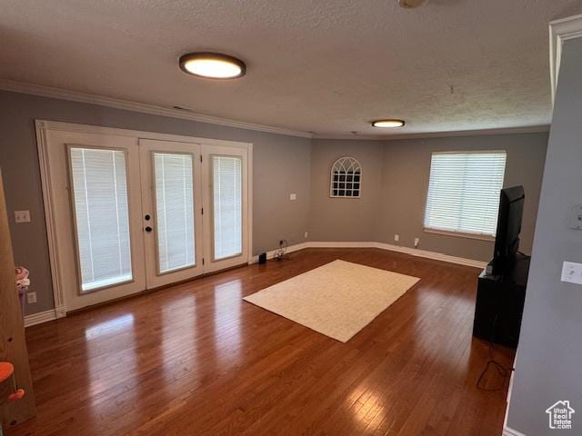 421 S 755 E, Layton, UT 84041 - unfurnished room featuring crown molding, dark wood-style flooring, french doors, and a textured ceiling