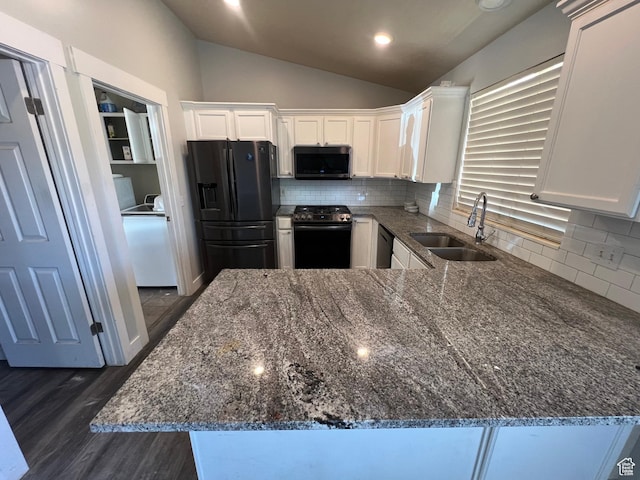 362 W 1800 S, Clearfield, UT 84015 - kitchen with black appliances, vaulted ceiling, dark stone countertops, white cabinetry, and dark wood-style floors