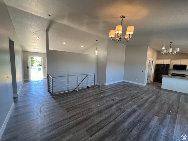 362 W 1800 S, Clearfield, UT 84015 - unfurnished living room featuring a chandelier, dark wood-type flooring, a textured ceiling, and recessed lighting