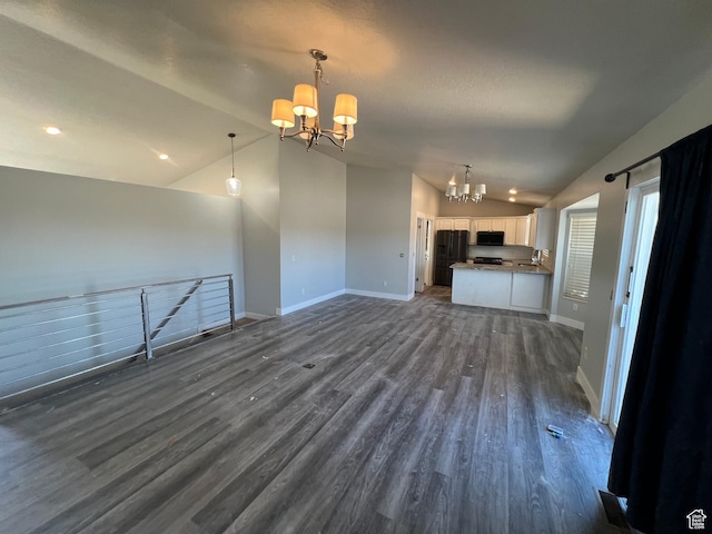 362 W 1800 S, Clearfield, UT 84015 - unfurnished living room with a chandelier, vaulted ceiling, dark wood-style flooring, and recessed lighting