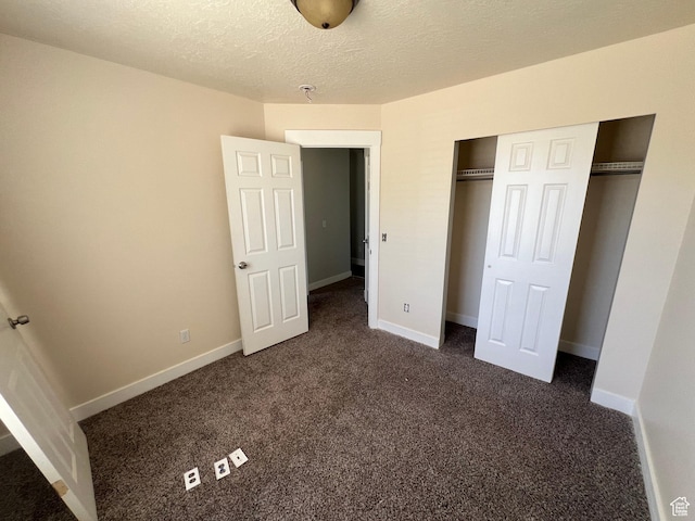 362 W 1800 S, Clearfield, UT 84015 - unfurnished bedroom with dark colored carpet, a closet, and a textured ceiling