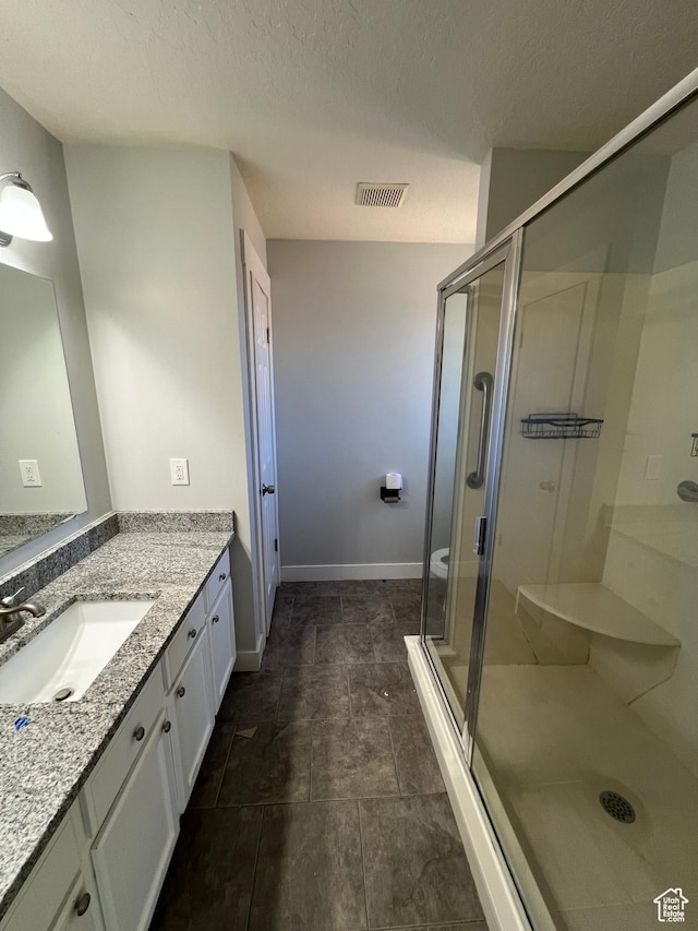 362 W 1800 S, Clearfield, UT 84015 - bathroom with vanity, a stall shower, and a textured ceiling
