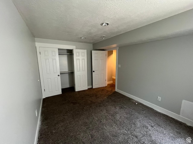 362 W 1800 S, Clearfield, UT 84015 - unfurnished bedroom with a textured ceiling, dark colored carpet, and a closet
