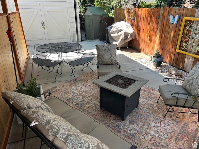 2537 S Taylor Ave E, Ogden, UT 84401 - view of patio / terrace featuring a storage shed, a fire pit, and a grill