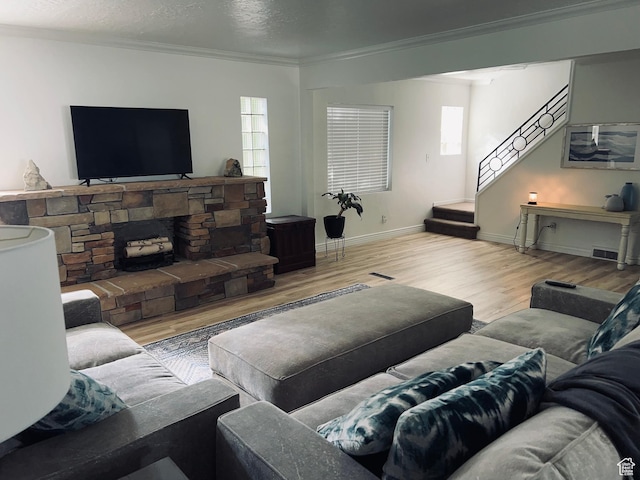 2537 S Taylor Ave E, Ogden, UT 84401 - living area with wood finished floors, ornamental molding, and stairway