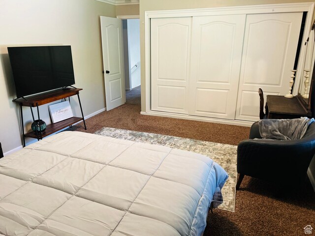 2537 S Taylor Ave E, Ogden, UT 84401 - bedroom featuring carpet flooring, a closet, and ornamental molding