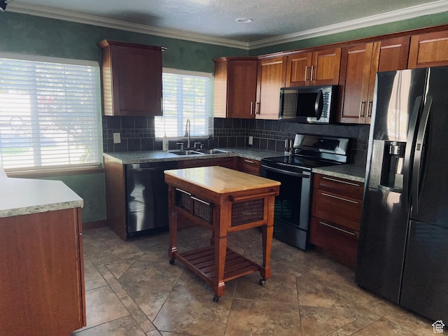 2537 S Taylor Ave E, Ogden, UT 84401 - kitchen featuring stainless steel appliances, decorative backsplash, ornamental molding, and light countertops