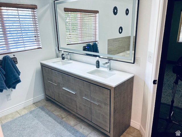 2537 S Taylor Ave E, Ogden, UT 84401 - bathroom featuring double vanity, plenty of natural light, and tile patterned flooring