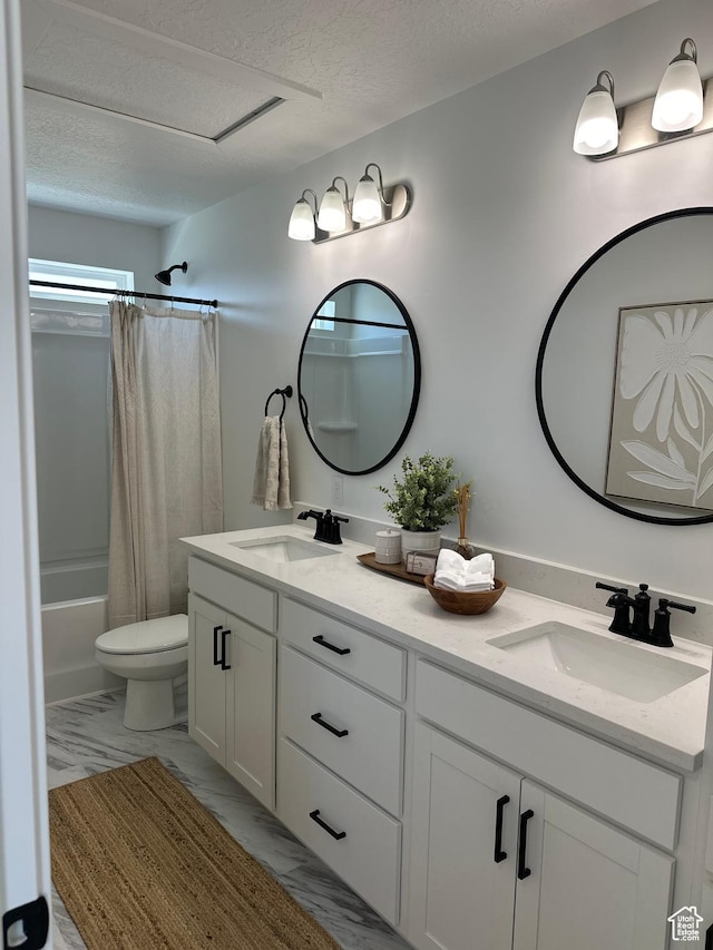 325 S 2800 E Unit 203, Spanish Fork, UT 84660 - bathroom featuring double vanity, a textured ceiling, shower / bath combination with curtain, and marble look tiles