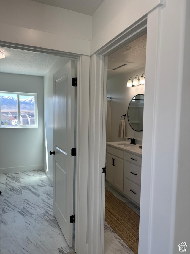 325 S 2800 E Unit 203, Spanish Fork, UT 84660 - bathroom with marble finish floors, vanity, and a textured ceiling