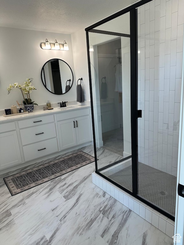 325 S 2800 E Unit 203, Spanish Fork, UT 84660 - bathroom featuring marble finish flooring, vanity, and a stall shower