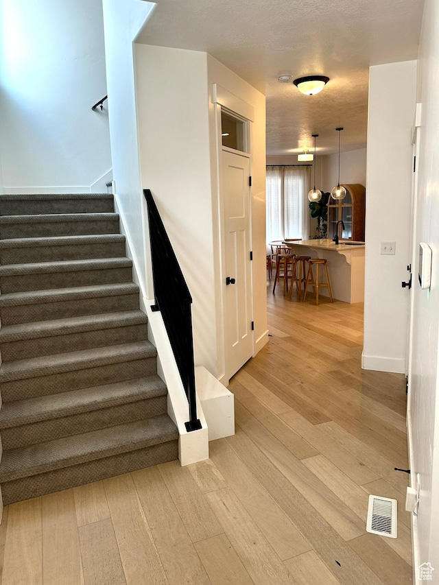 214 W Whitewater Dr, Vineyard, UT 84059 - stairway featuring wood finished floors