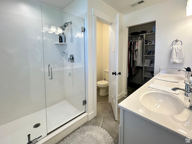 214 W Whitewater Dr, Vineyard, UT 84059 - bathroom with a stall shower, a spacious closet, double vanity, and tile patterned floors