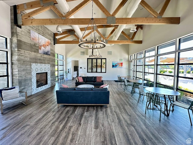 214 W Whitewater Dr, Vineyard, UT 84059 - living room with high vaulted ceiling, healthy amount of natural light, beamed ceiling, wood finished floors, and a fireplace