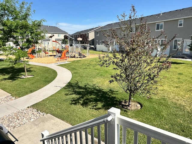 214 W Whitewater Dr, Vineyard, UT 84059 - view of grassy yard featuring a playground and a residential view
