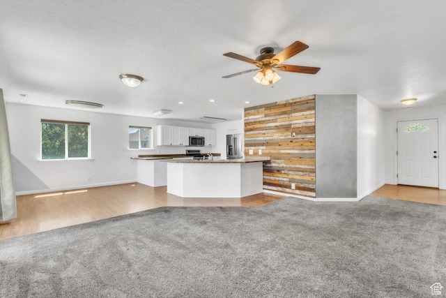 985 W 2675 S, Nibley, UT 84321 - unfurnished living room featuring light carpet and a ceiling fan
