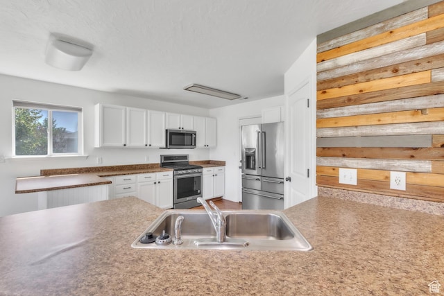 985 W 2675 S, Nibley, UT 84321 - kitchen featuring stainless steel appliances and white cabinetry