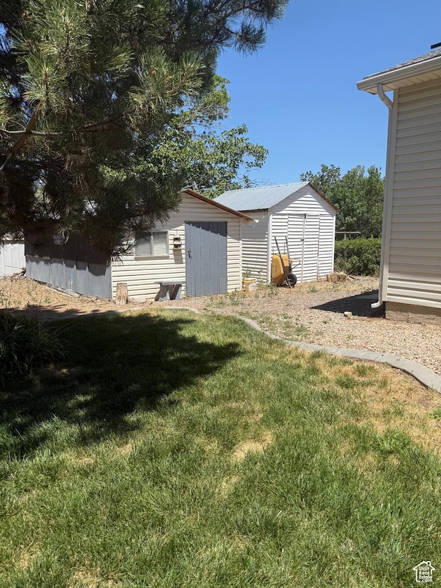 90 W Cherry St W, Grantsville, UT 84029 - view of grassy yard with a storage unit