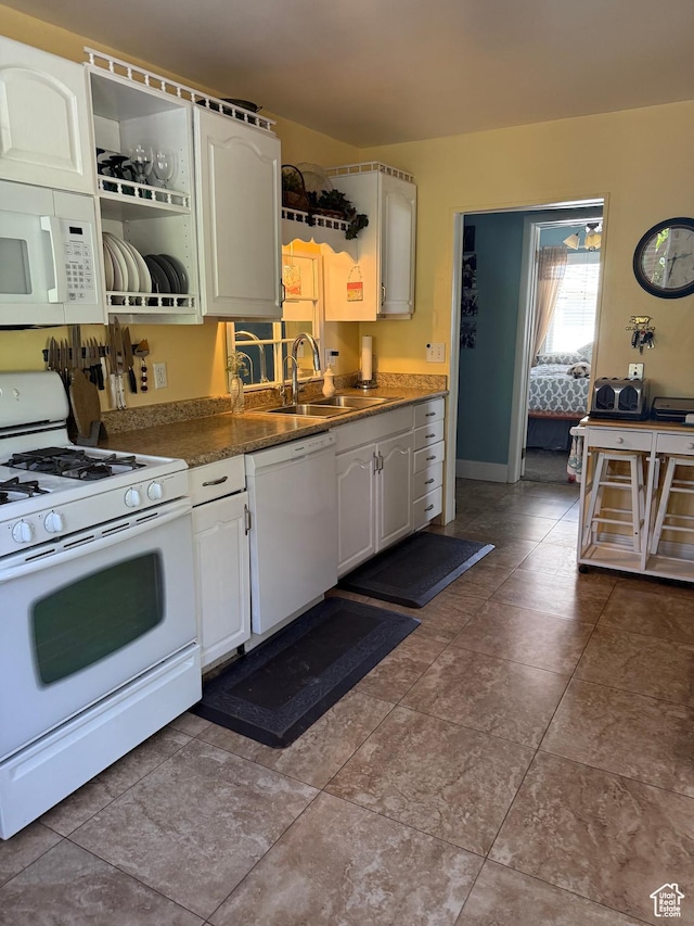 90 W Cherry St W, Grantsville, UT 84029 - kitchen featuring white appliances, white cabinetry, and dark countertops